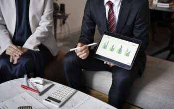 business-people-working-with-ipad-high-angle