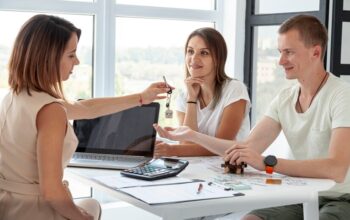 couple-accepting-keys-their-new-house_23-2148346270