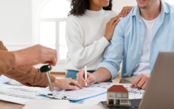 smiley-couple-signing-contract-new-house_23-2148895489